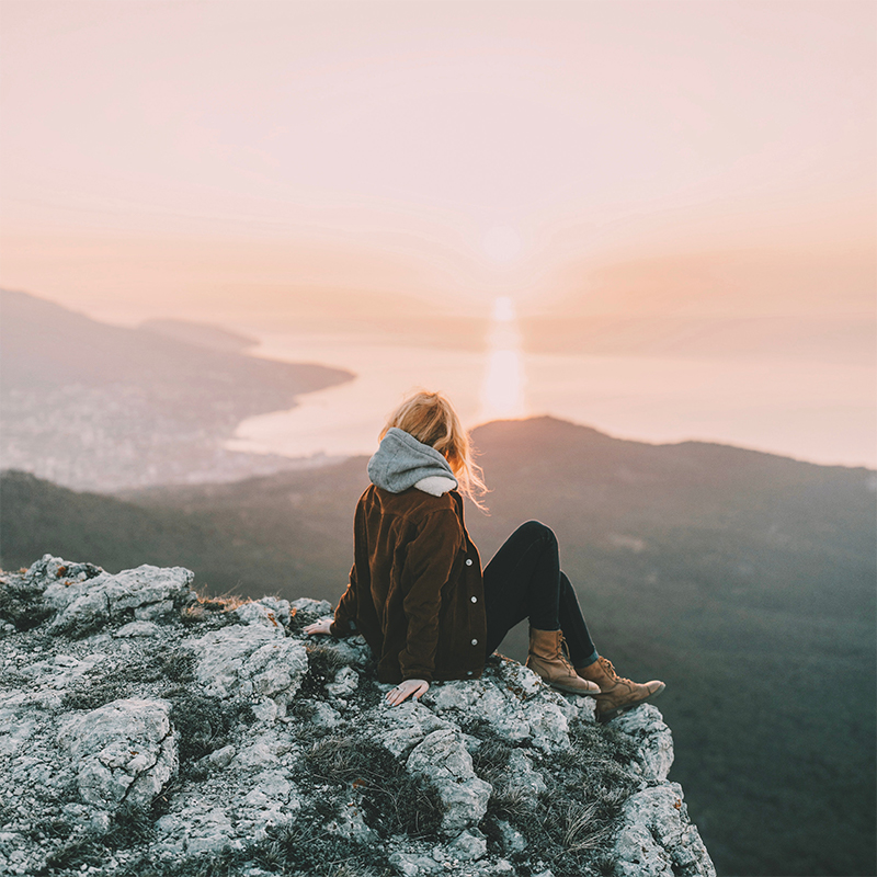 Woman overlooking Mountain Landscape